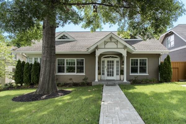 1926 20th Ave S, Nashville, TN 37212 - english style home with fence, a front lawn, french doors, and roof with shingles