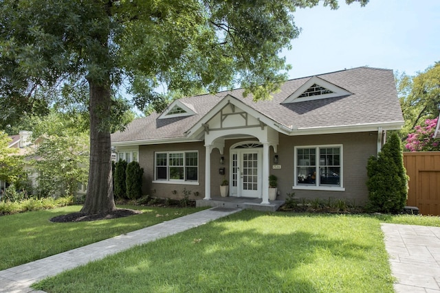 1926 20th Ave S, Nashville, TN 37212 - view of front of home with a front yard, fence, french doors, and roof with shingles