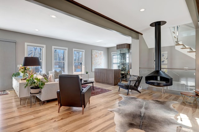 1926 20th Ave S, Nashville, TN 37212 - living room featuring light wood finished floors, baseboards, stairway, recessed lighting, and a wood stove