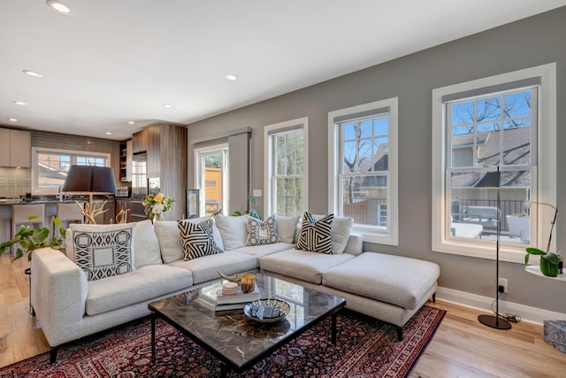 1926 20th Ave S, Nashville, TN 37212 - living area with light wood finished floors, a wealth of natural light, and baseboards