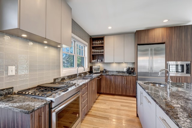 1926 20th Ave S, Nashville, TN 37212 - kitchen featuring built in appliances, light wood-style floors, a sink, and open shelves