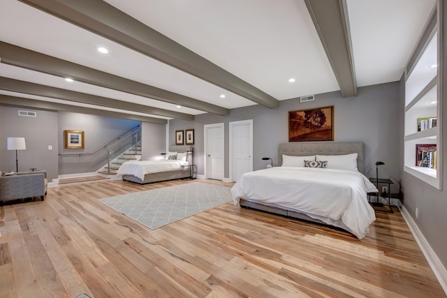 1926 20th Ave S, Nashville, TN 37212 - bedroom with light wood-type flooring, beam ceiling, baseboards, and visible vents
