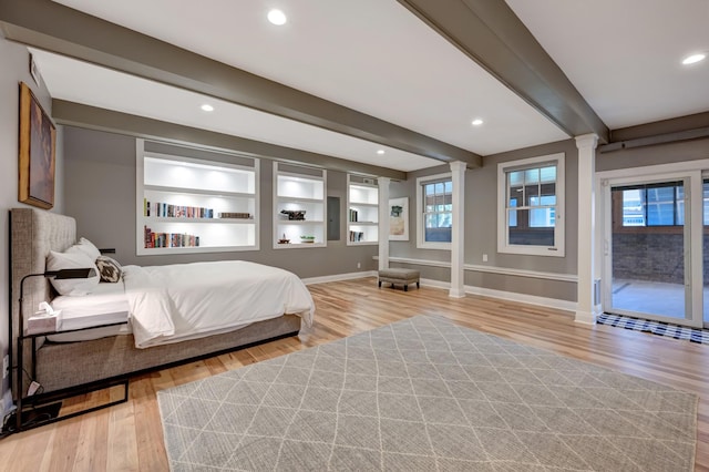 1926 20th Ave S, Nashville, TN 37212 - bedroom with recessed lighting, ornate columns, baseboards, beamed ceiling, and light wood-style flooring