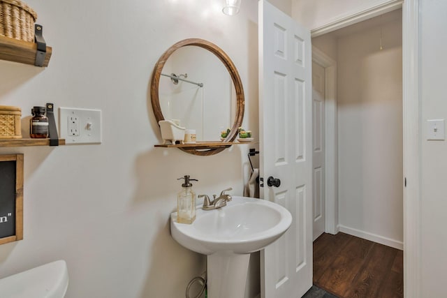 3355 Clearwater Dr, Clarksville, TN 37042 - bathroom featuring toilet, baseboards, and wood finished floors