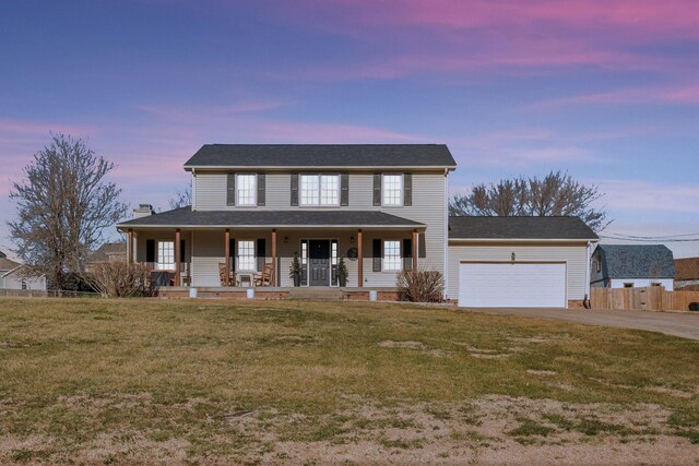 3355 Clearwater Dr, Clarksville, TN 37042 - view of front of house with fence, a porch, a yard, a garage, and driveway