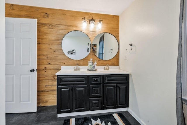 3355 Clearwater Dr, Clarksville, TN 37042 - bathroom featuring a sink, baseboards, wood walls, and double vanity