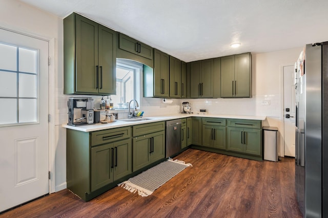3355 Clearwater Dr, Clarksville, TN 37042 - kitchen with dark wood finished floors, a sink, light countertops, appliances with stainless steel finishes, and green cabinets