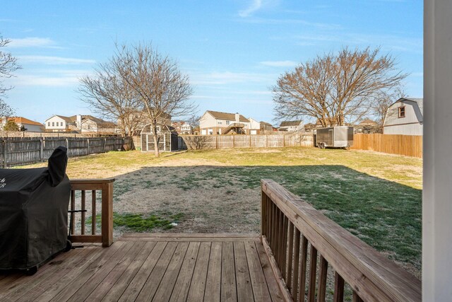 3355 Clearwater Dr, Clarksville, TN 37042 - wooden terrace featuring a storage unit, a fenced backyard, a yard, a residential view, and an outdoor structure