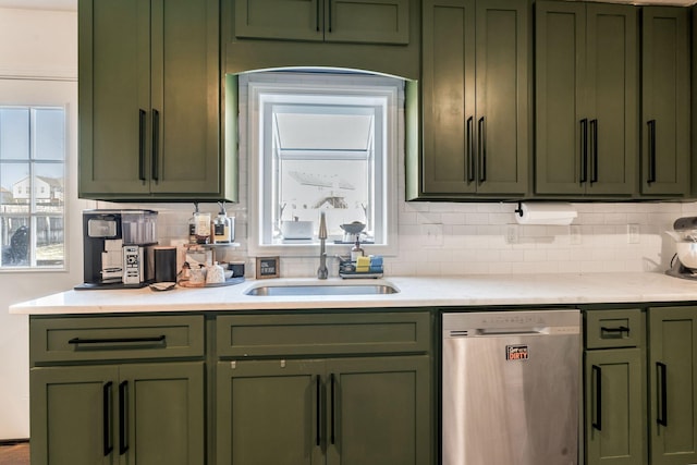 3355 Clearwater Dr, Clarksville, TN 37042 - kitchen featuring green cabinets, light countertops, stainless steel dishwasher, and a sink