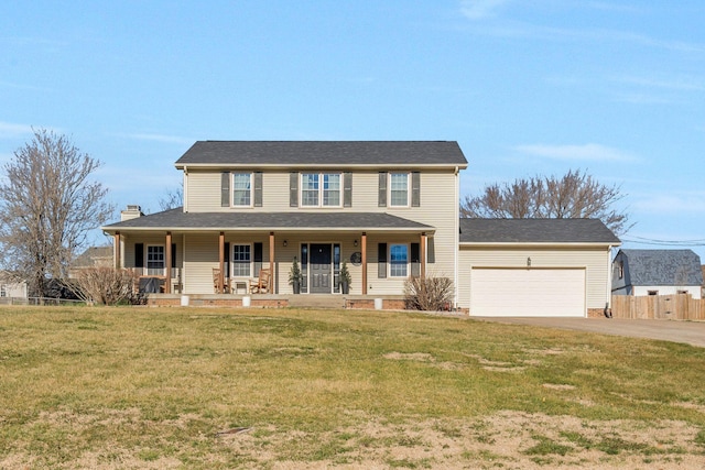 3355 Clearwater Dr, Clarksville, TN 37042 - colonial-style house featuring a front lawn, driveway, a porch, fence, and a garage