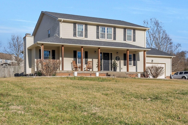 3355 Clearwater Dr, Clarksville, TN 37042 - view of front of property with a chimney, an attached garage, covered porch, and a front lawn
