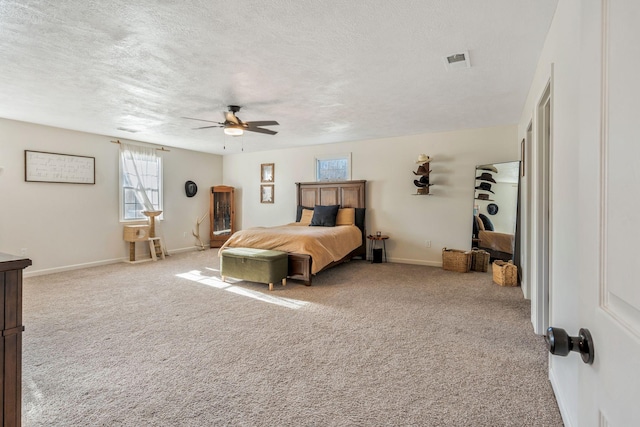 3355 Clearwater Dr, Clarksville, TN 37042 - carpeted bedroom featuring visible vents, baseboards, a textured ceiling, and ceiling fan