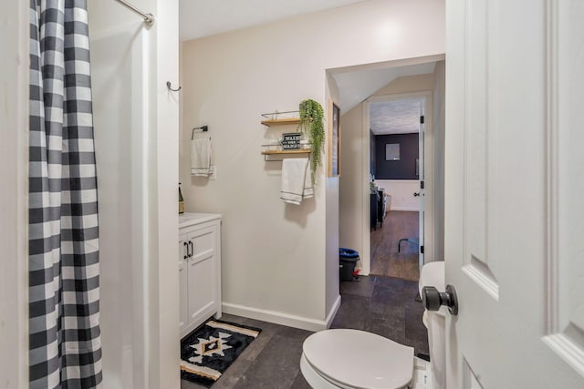 3355 Clearwater Dr, Clarksville, TN 37042 - full bath featuring curtained shower, baseboards, and wood finished floors
