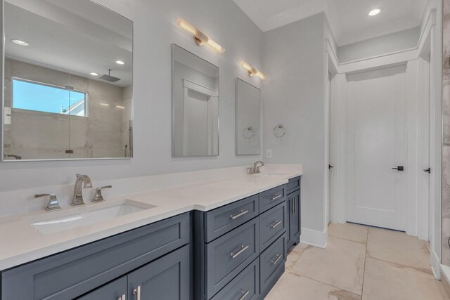 full bath with double vanity, walk in shower, recessed lighting, and a sink