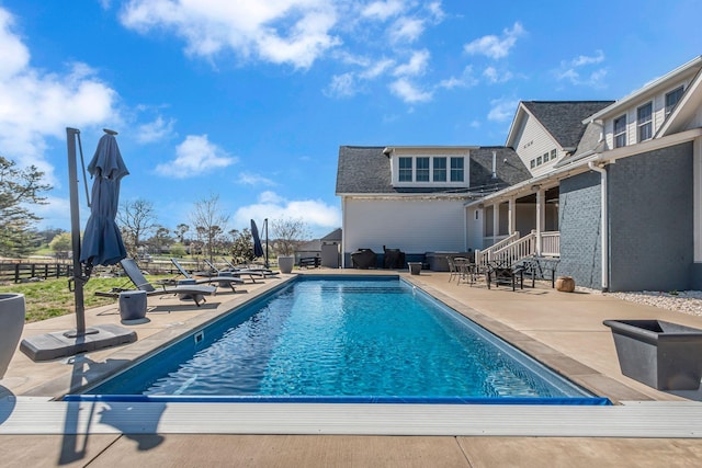 outdoor pool with a patio