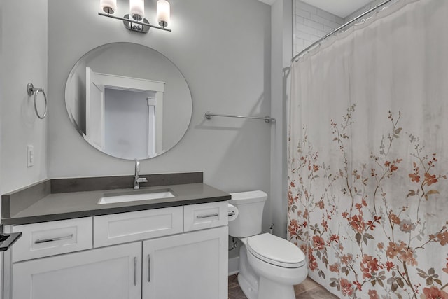bathroom with tile patterned floors, toilet, vanity, and a shower with shower curtain
