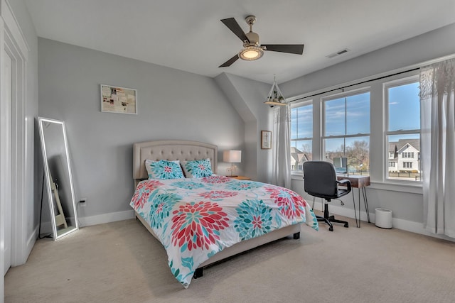 carpeted bedroom with visible vents, ceiling fan, and baseboards