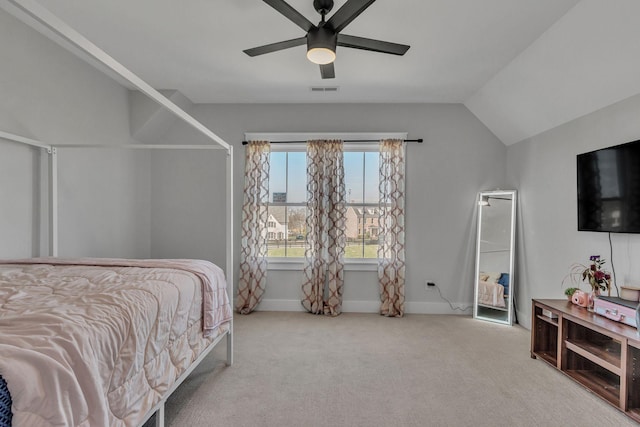 carpeted bedroom featuring baseboards, visible vents, a ceiling fan, and lofted ceiling