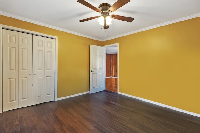 unfurnished bedroom with dark wood-style floors, baseboards, and ornamental molding