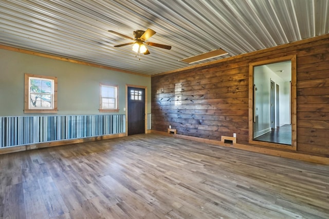 empty room with ceiling fan and wood finished floors
