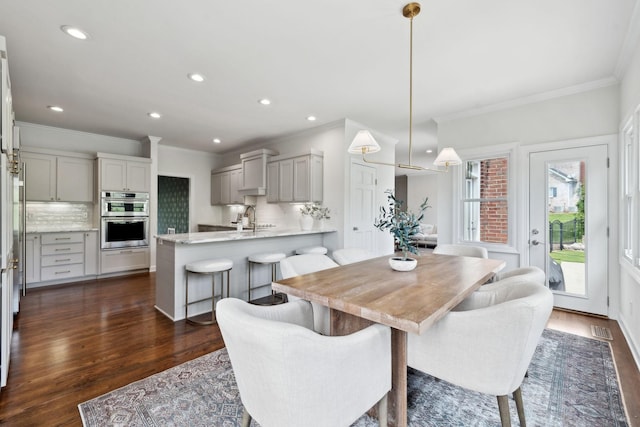 dining room featuring recessed lighting, dark wood finished floors, visible vents, and crown molding