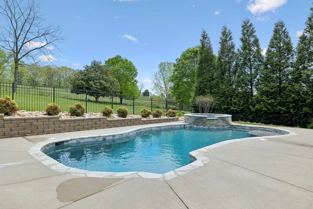 view of swimming pool featuring a fenced backyard, a patio, and a pool with connected hot tub