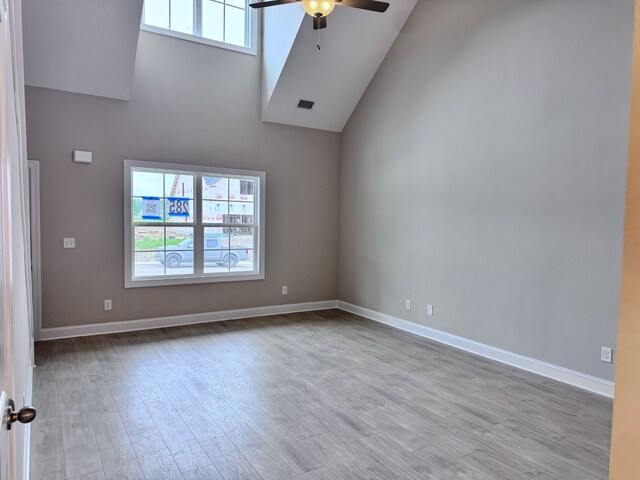 443 Generosity Way, Smyrna, TN 37167 - empty room featuring ceiling fan, wood finished floors, high vaulted ceiling, and baseboards