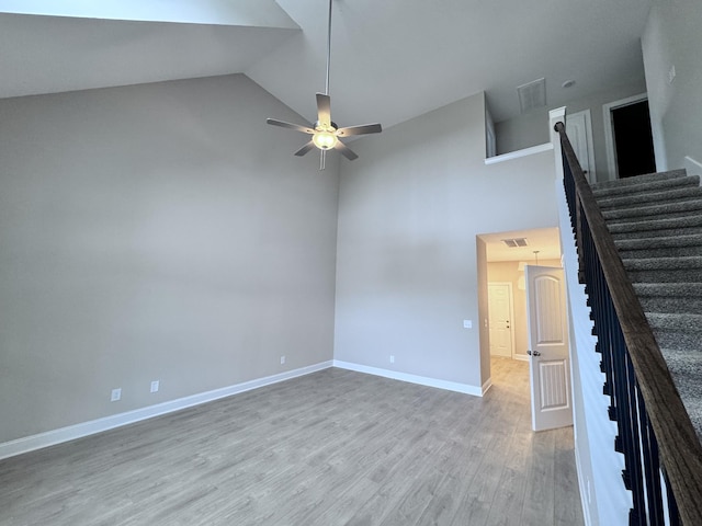 443 Generosity Way, Smyrna, TN 37167 - spare room with high vaulted ceiling, wood finished floors, ceiling fan, stairway, and baseboards