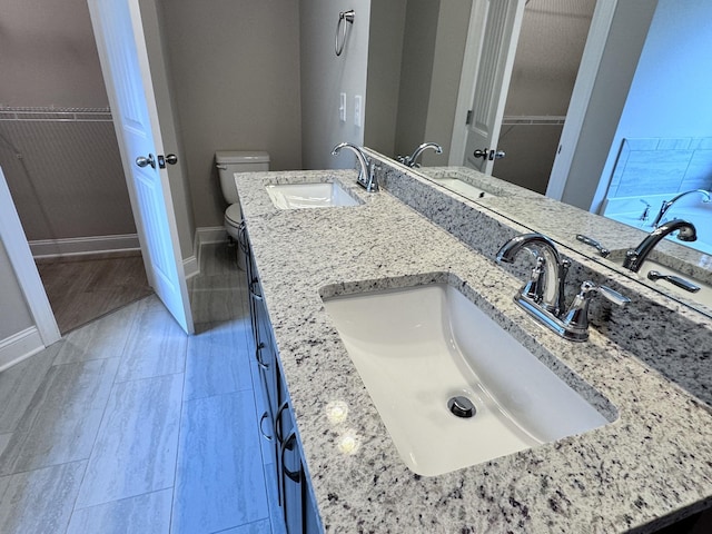 443 Generosity Way, Smyrna, TN 37167 - bathroom with toilet, baseboards, a spacious closet, and double vanity