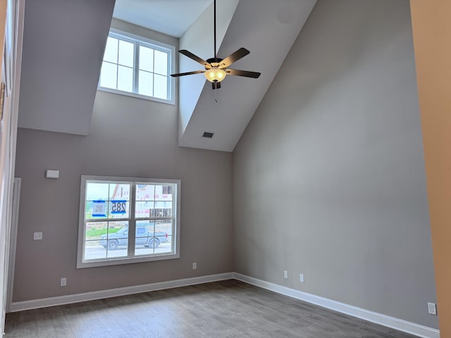 443 Generosity Way, Smyrna, TN 37167 - unfurnished room with a ceiling fan, wood finished floors, high vaulted ceiling, and baseboards