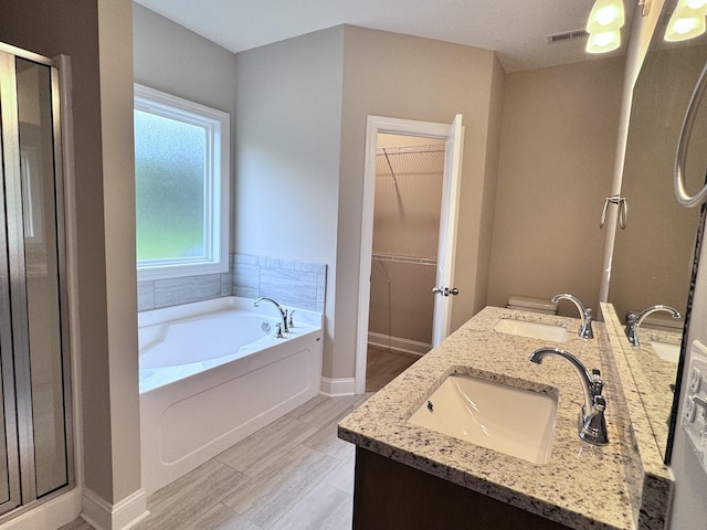 443 Generosity Way, Smyrna, TN 37167 - full bath with a stall shower, a bath, a walk in closet, baseboards, and double vanity