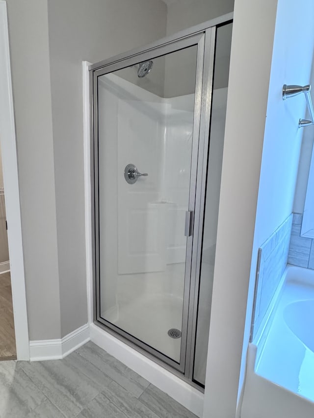 443 Generosity Way, Smyrna, TN 37167 - bathroom featuring a stall shower, a bath, and baseboards