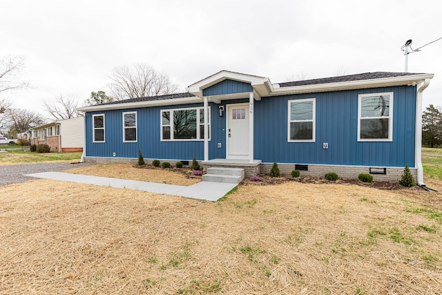 ranch-style home featuring crawl space, a front lawn, and roof with shingles