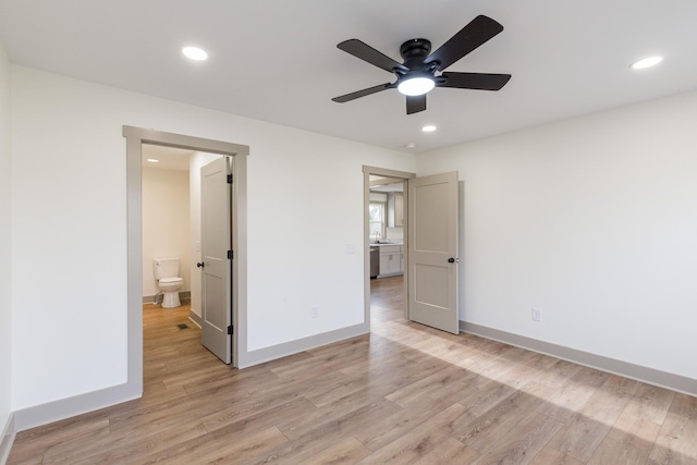 unfurnished bedroom featuring recessed lighting, baseboards, and light wood finished floors