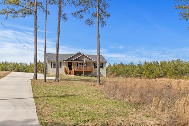 2619 Prospect Rd, Dalton, GA 30721 - view of front facade with crawl space, a porch, and a front lawn