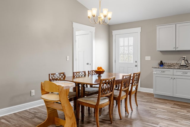 2619 Prospect Rd, Dalton, GA 30721 - dining area featuring baseboards, light wood finished floors, and a chandelier