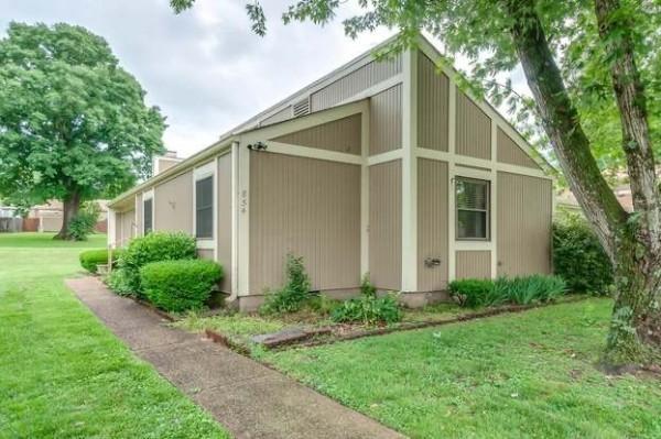 854 Todd Preis Dr, Nashville, TN 37221 - view of side of property featuring a yard and a chimney