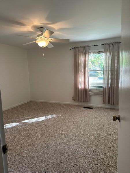 854 Todd Preis Dr, Nashville, TN 37221 - empty room with visible vents, baseboards, carpet, and a ceiling fan