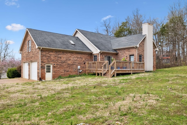 back of property featuring roof with shingles, a yard, an attached garage, a chimney, and brick siding