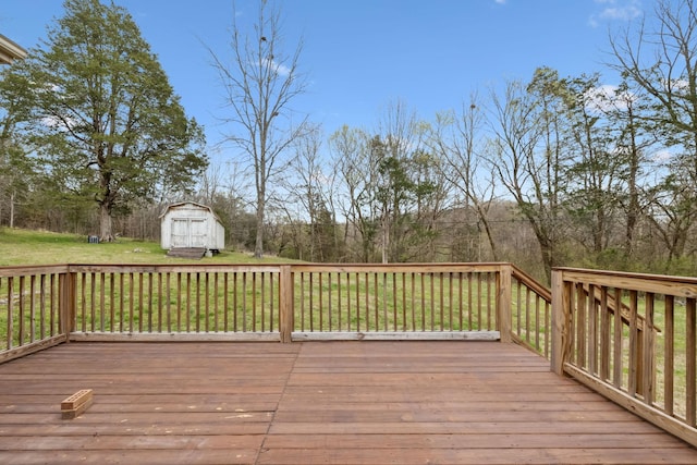 deck featuring a yard, an outbuilding, and a storage shed