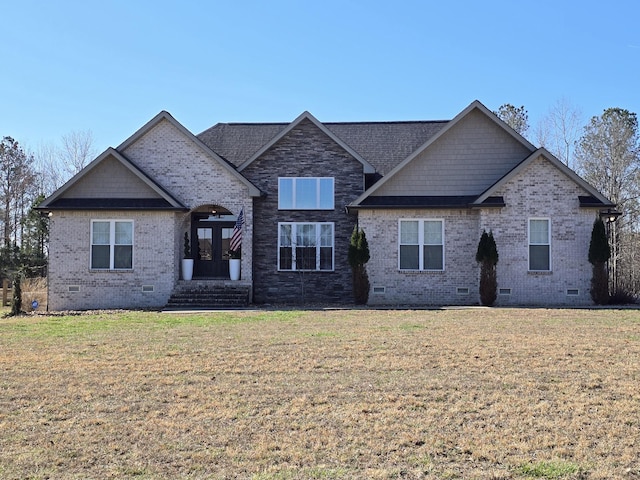 view of front facade with crawl space, french doors, brick siding, and a front lawn