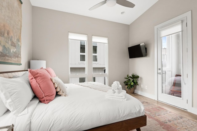 bedroom with baseboards, ceiling fan, and light wood-style floors