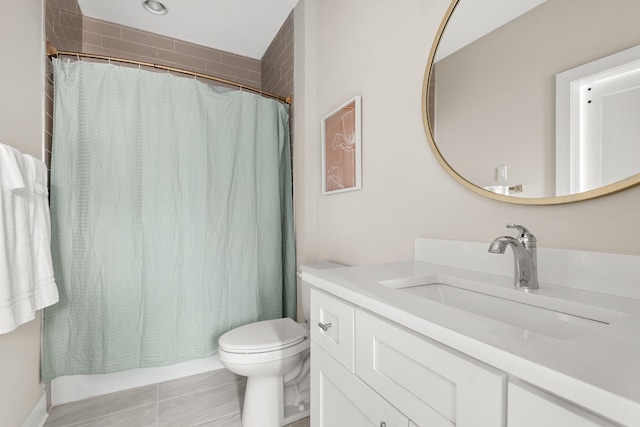 full bathroom with toilet, vanity, and a shower with curtain