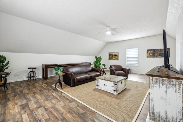 living area with wood finished floors, baseboards, vaulted ceiling, and ceiling fan