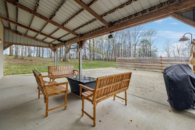 view of patio featuring an outdoor living space, fence, and area for grilling