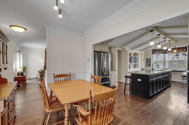 dining area with dark wood-style floors, crown molding, a textured ceiling, and lofted ceiling with beams