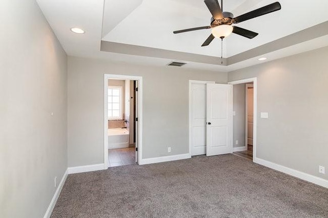 1033 Garner Hills Dr, Clarksville, TN 37042 - unfurnished bedroom with visible vents, baseboards, carpet, and a tray ceiling