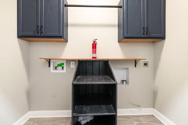 1033 Garner Hills Dr, Clarksville, TN 37042 - laundry room featuring cabinet space, baseboards, hookup for an electric dryer, and hookup for a washing machine