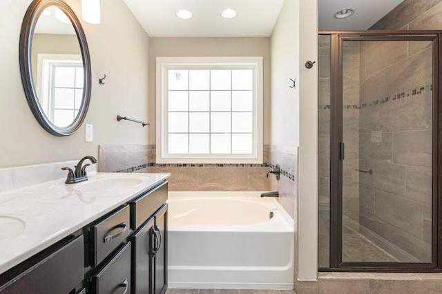 1033 Garner Hills Dr, Clarksville, TN 37042 - full bath featuring a garden tub, a stall shower, a sink, recessed lighting, and double vanity