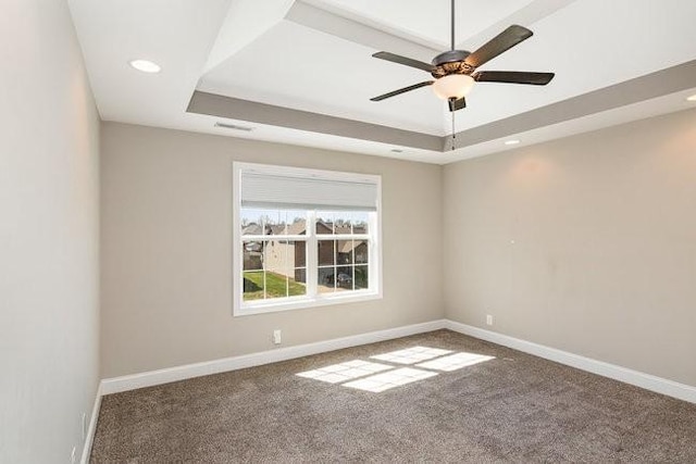 1033 Garner Hills Dr, Clarksville, TN 37042 - spare room featuring baseboards, a raised ceiling, ceiling fan, and carpet flooring